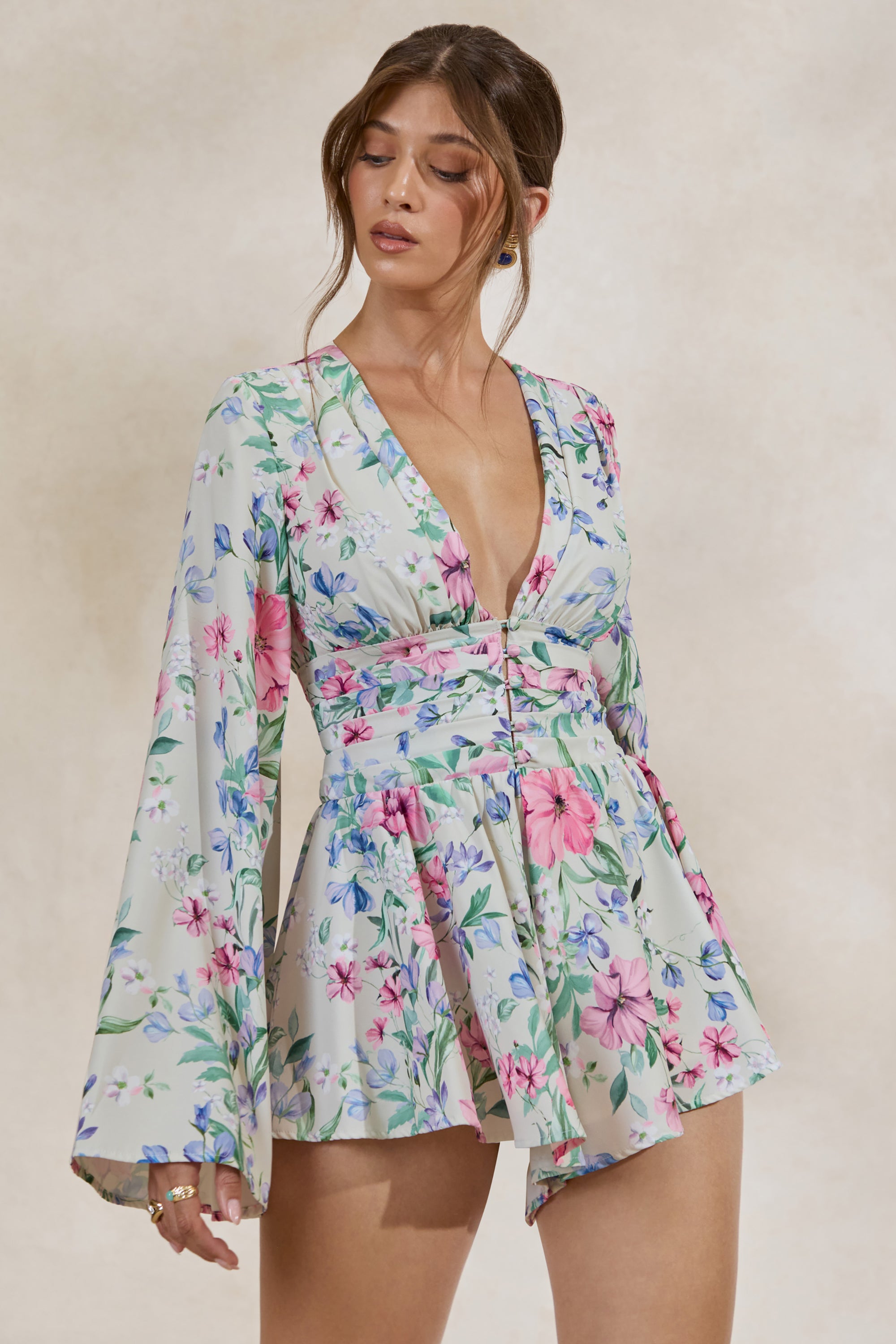 ECM_HR_CL138202111---Kismet-_-Cream-Floral-Print-Plunge-Neck-Playsuit-With-Bell-Sleeves1.jpg